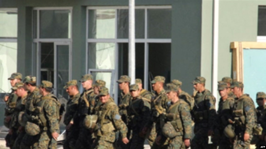 Georgian soldiers returning to their base in Gori this week.