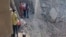 A video grab taken from UGC images posted on social media on February 28 and verified by AFP shows people inspecting the damage at an impact site following US and Israeli strikes on Tehran.