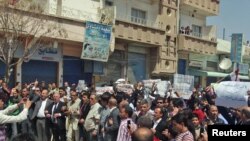 Mostly ethnic Kurdish demonstrators marched after Friday prayers in Qamishli, Syria, on April 15.