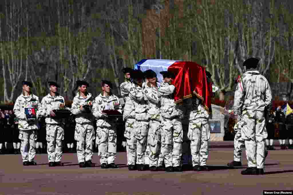 French servicemen on March 16 carry the flag-draped coffin of Arnaud Frion, a soldier killed by an Iranian drone attack on a Kurdish base in northeastern Iraq on March 12.The 42-year-old was part of a military contingent deployed to Iraq's Kurdistan region to combat a potential resurgence of the Islamic State extremist group.