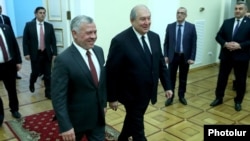 Armenia -- Armenian President Armen Sarkissian (R) and Jordan's King Abdullah arrive at the presidential palace in Yerevan, February 11, 2020. 