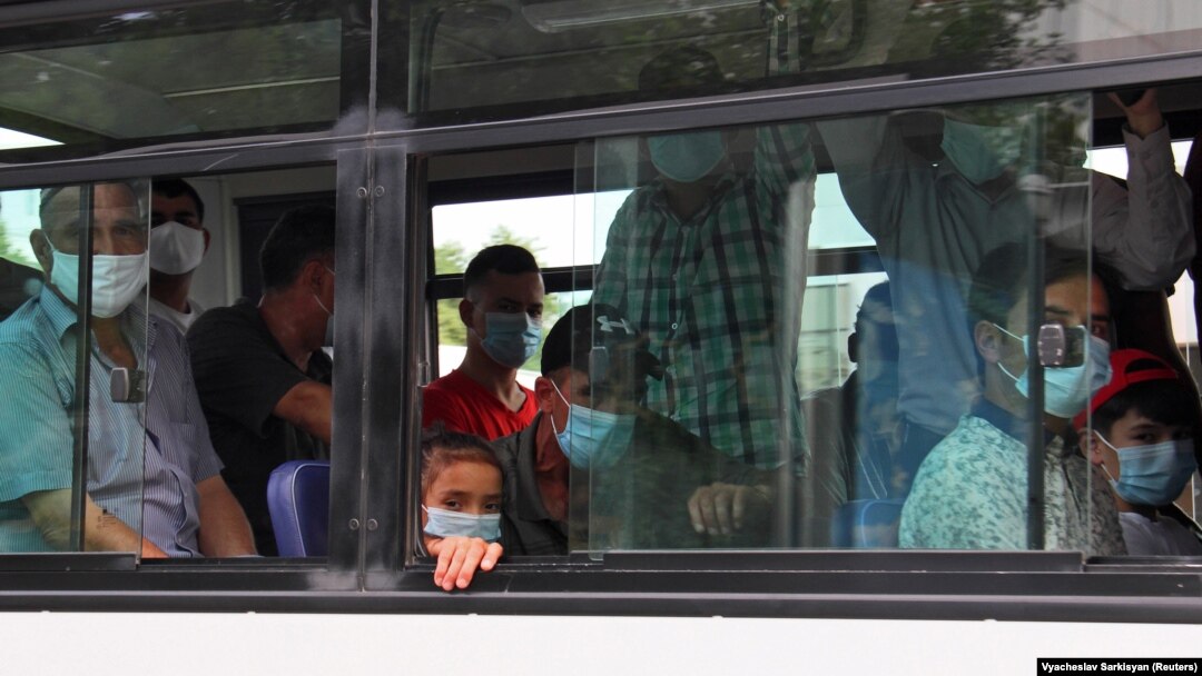 People wearing protective face masks inside a bus in Ashgabat, the capital of Turkmenistan where the coronavirus officially does not exist.