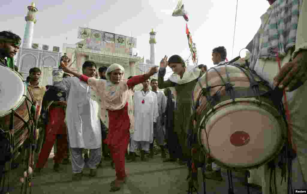 Sufis dance at the shrine in 2008. During the festival the air is heavy with drumbeats, chanting and cannabis smoke.&nbsp;