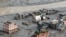 An aerial view shows houses lying deluged in sludge after flash floods at Devighat, Bidur Municipality in Nepal's Nuwakot district on August 27, 2026.