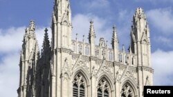 U.S. - The top of the pinnacle (C) of the National Cathedral Washington is damaged after an earthquake struck the east coast of the United States, 23Aug2011