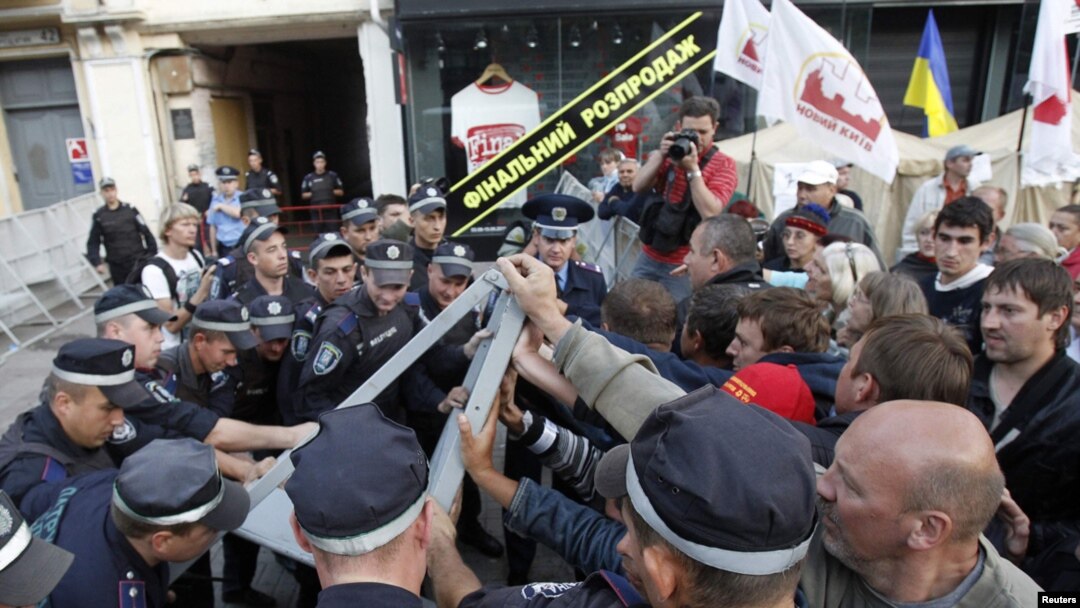 Ukrainian security personnel block supporters of Yulia Tymoshenko during a protest rally outside the court in Kyiv on August 8.