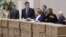 Mikhail Prokhorov (third from left) and members of his campaign staff and election officials appear with boxes containing signatures to support his presidential candidacy at the Central Election Commission in Moscow on January 18.