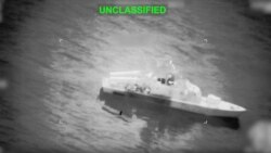 A screen grab from video released by US Central Command on March 10 shows what they say is an Iranian naval vessel just before it is struck by a projectile near the Strait of Hormuz.