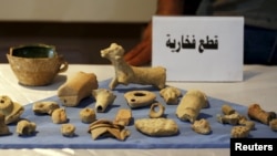 Looted artifacts recovered from Islamic State fighters are seen at the National Museum of Iraq in Baghdad in 2015.