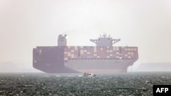 An Iran-flagged container vessel is pictured anchored in the Strait of Hormuz off Bandar Abbas in southern Iran.
