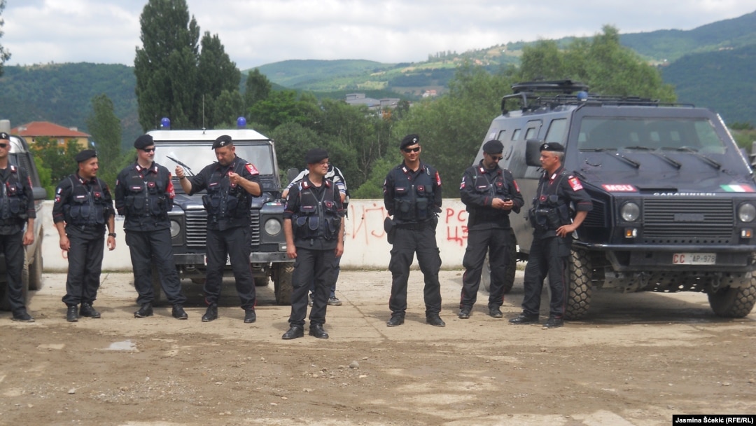 Kosovo -- Eulex forces, citizens moved barricade on the bridge over river Ibar in north part of Mitrovica, replacing it with flowerpots. 18 June 2014.