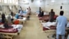 The injured receive treatment at a hospital following a suicide attack in Jalalabad on June 11.