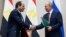 Russian President Vladimir Putin (left) and Egyptian President Abdel-Fattah al-Sisi shake hands after a signing ceremony following their talks in Sochi on October 17.