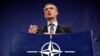 NATO Secretary-General Jens Stoltenberg gestures during a press conference at the military alliance's headquarters in Brussels on December 1. 