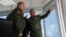 Russian Defense Minister Sergei Shoigu (center) and General Valery Gerasimov (left) observe military drills in Crimea on April 22.