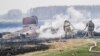 Firefighters tackle the blaze in the village of Karakul.