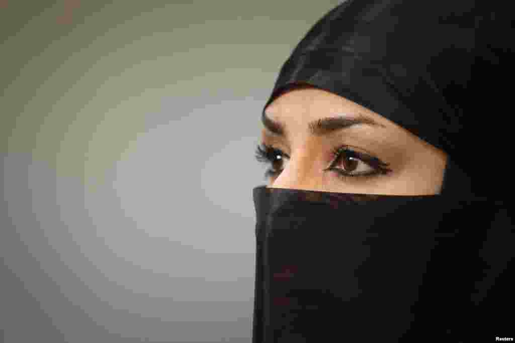 An Iranian women looks on as she waits to showcase her skills to the media in a gym at Karaj.