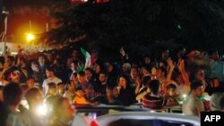 File photo:Iranians celebrate on the streets of Tehran early on June 13, 2017, after their national football team won the 2018 World Cup qualifying football match between Iran and Uzbekistan. (Photo by STRINGER / AFP)