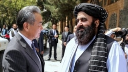 Taliban Foreign Minister Amir Khan Muttaqi welcomes Chinese Foreign Minister Wang Yi to Kabul ahead of a August 20 trilateral meeting with Pakistan. 