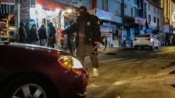 Taliban security personnel stand guard at the blast site following a January 19 explosion on a Chinese hotel restaurant in Kabul that was claimed by Islamic State-Khorasan Province (IS-K). 