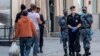 Soldiers from Russia's national guard and police officers patrol in downtown Moscow on June 8.