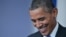 U.S. President Barack Obama enjoys a lighter moment during his end-of-year press conference at the White House on December 20.
