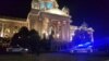 Police investigators attend the scene of the incident in front of Serbian parliament on January 23. 