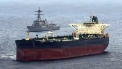 The Arleigh Burke-class guided-missile destroyer USS Rafael Peralta takes part in a maritime blockade against an Iran-flagged crude oil tanker vessel.