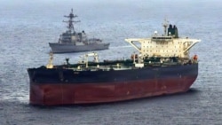 The USS Rafael Peralta implements a maritime blockade against a Iran-flagged crude oil tanker vessel in May. 