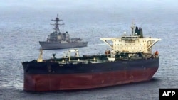 The US Navy's Arleigh Burke-class guided-missile destroyer USS Rafael Peralta (DDG 115) takes part in a maritime blockade against an Iran-flagged crude oil tanker vessel on April 24. 