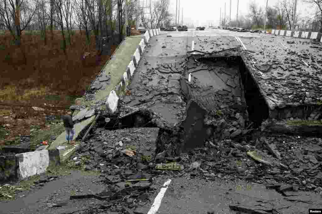 A man looks at a road that was destroyed during battles between Ukrainian armed forces and Russian-backed separatists in Donetsk. (Reuters/Aleksandr Ermochenko)