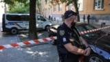 A police officer guards the murder site of former Ukrainian parliamentary speaker Andriy Parubiy in Lviv.