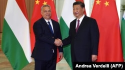 Hungarian Prime Minister Viktor Orban (left) shakes hands with Chinese President Xi Jinping during a meeting in Beijing in April 2019.