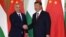 Hungarian Prime Minister Viktor Orban (left) shakes hands with Chinese President Xi Jinping during a visit to Beijing in 2019. 