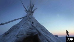 A Nenets reindeer herder on the frozen tundra some 200 kilometers northwest of Naryan-Mar.