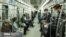 Commuters wearing masks against coronavirus on Tehran underground (metro) on April 7, 2020. 