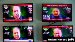 Pakistani television channels showing former Prime Minister Nawaz Sharif address to opposition parties meeting in Islamabad on September 20.