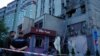 Rescuers work at the site of a building damaged during a Russian suicide drone strike in Kyiv on May 28.