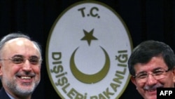 Iranian Foreign Minister Ali Akbar Salehi (left) Turkish Foreign Minister Ahmet Davutoglu in Ankara.