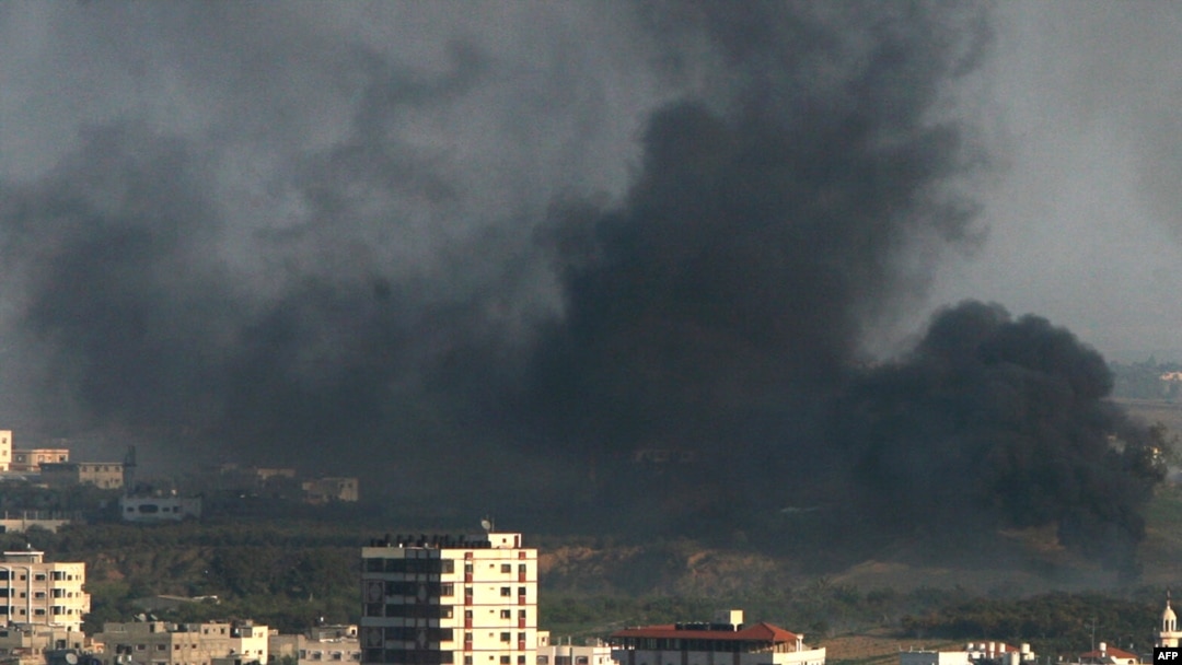 Smoke rises over Gaza City in the second week of the conflict
