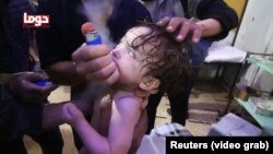 A child cries as it receives treatment following an alleged chemical weapons attack in the Syrian town of Douma on April 7. 