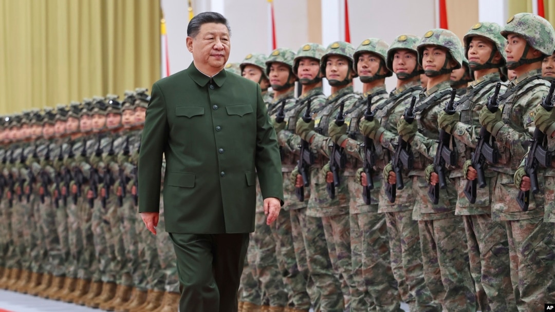 Chinese leader Xi Jinping reviews troops during his inspection of the Chinese People's Liberation Army (PLA) garrison stationed in the Macao Special Administrative Region on December 20.