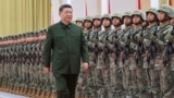 Chinese leader Xi Jinping reviews troops during his inspection of the Chinese People's Liberation Army (PLA) garrison stationed in the Macao Special Administrative Region on December 20.