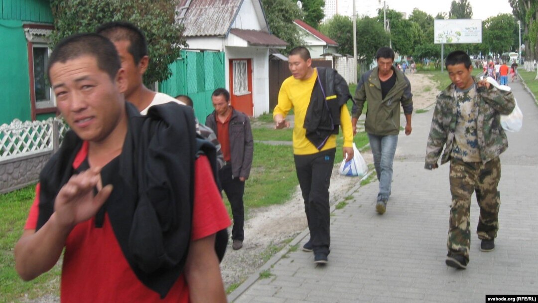 Chinese workers marching to protest unpaid wages. 