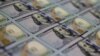 Dollars-US Debt-WASHINGTON, DC - MAY 20: Newly redesigned $100 notes lay in stacks at the Bureau of Engraving and Printing on May 20, 2013 in Washington, DC. 