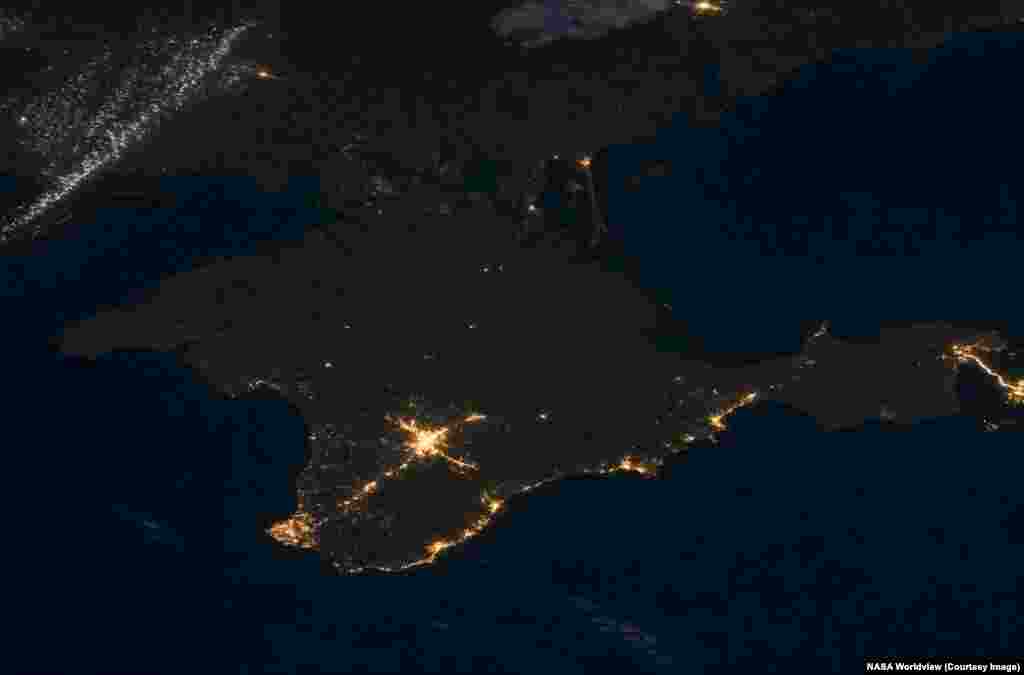 South of the Donbas, on the Russian-held Crimean Peninsula, darkness recently prevailed in many areas due to an ongoing Ukrainian drone campaign targeting Crimea's electricity network. These images were taken on July 8, 2021 and July 3, 2026.