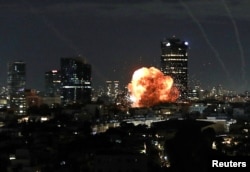 An explosion caused by a projectile impact after Iran launched missiles into Israel, Tel Aviv.