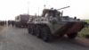 Russian Army military vehicles are seen on a joint patrol with Turkish troops on the western outskirts of the Syrian city of Saraqib in Idlib Province in March 2020.