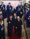 Președintele rus, Vladimir Putin, și președintele chinez, Xi Jinping, participă la o recepție la Moscova.