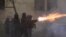 Police in riot gear fire tear gas during a fourth day of nationwide protests against a government decision to shelve EU membership talks in Tbilisi early on December 2, 2024.